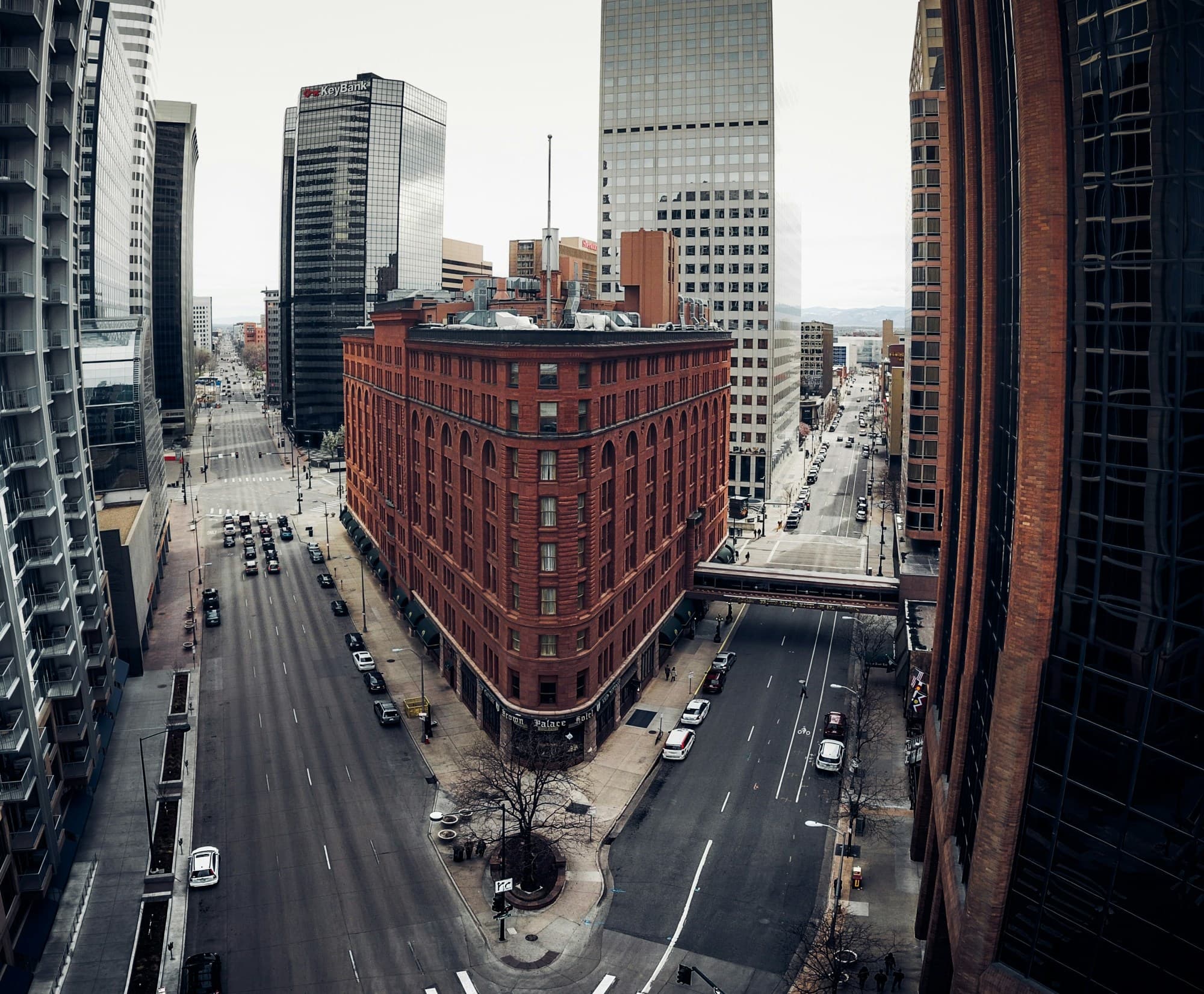 Corner of a city with buildings on a cloudy day.