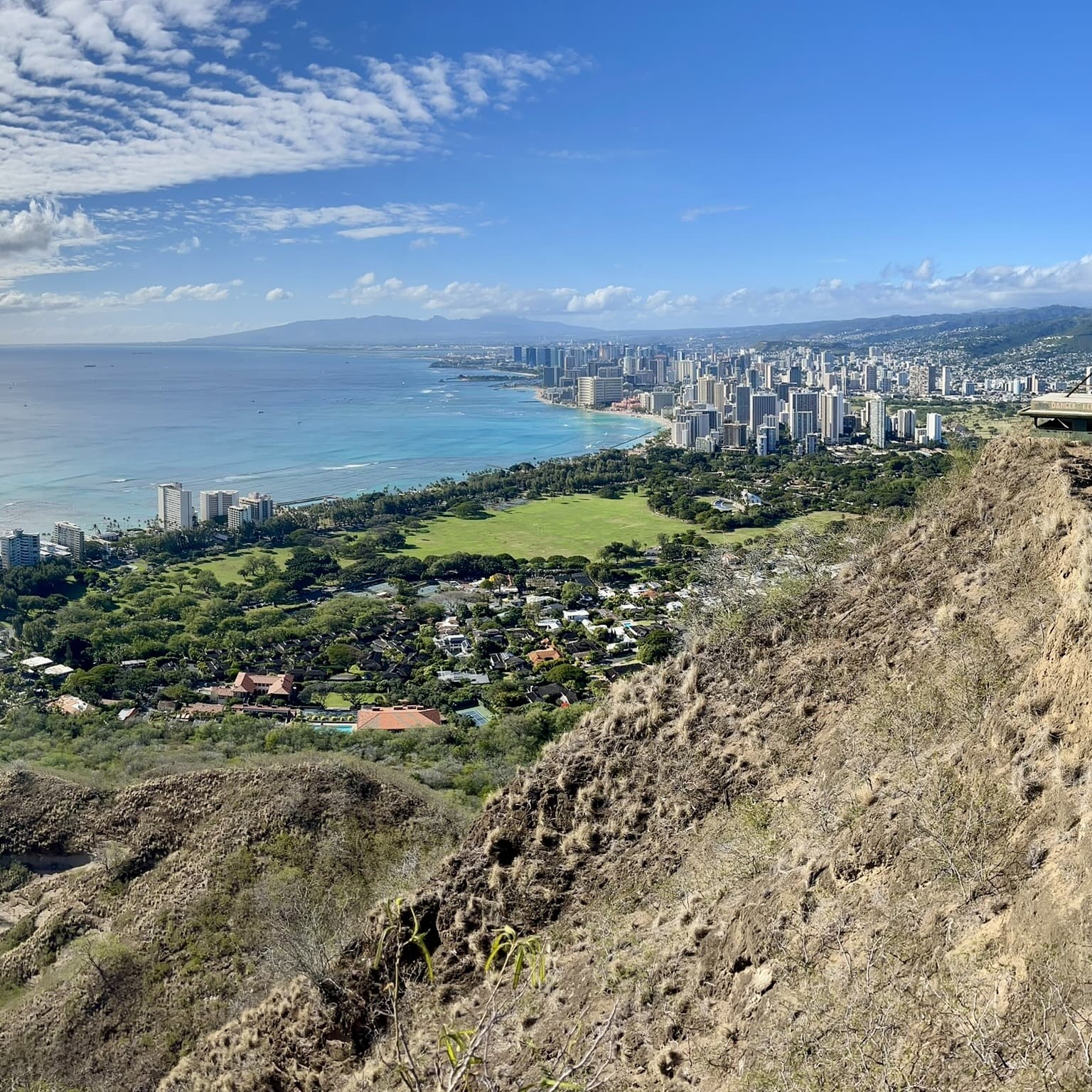 Aerial view of Island with ocean and buildings.