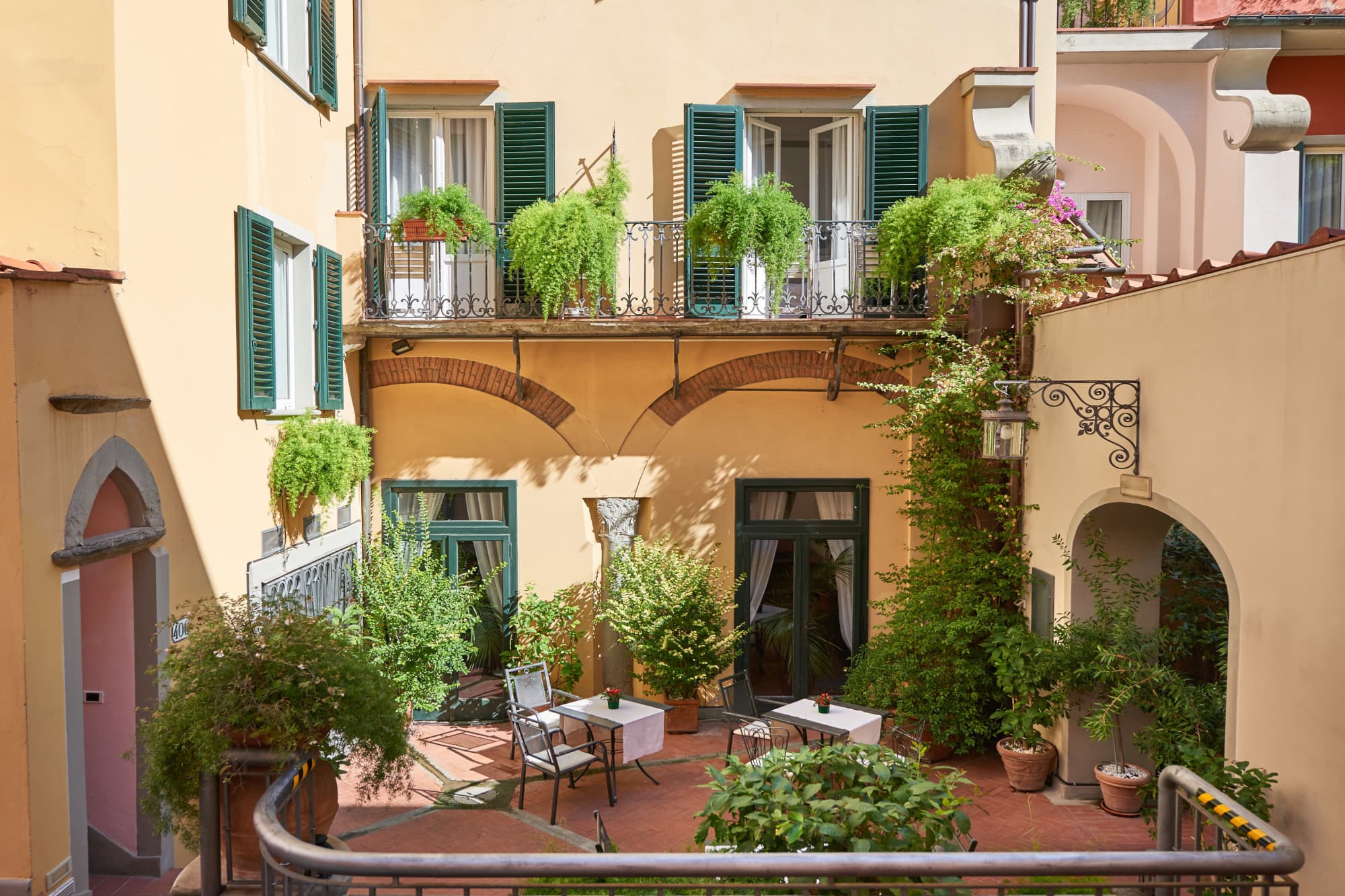 tables and chairs in a charming courtyard