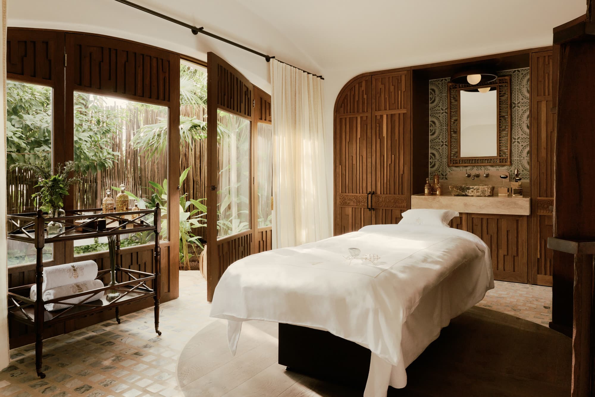 a luxe spa treatment room in the jungle