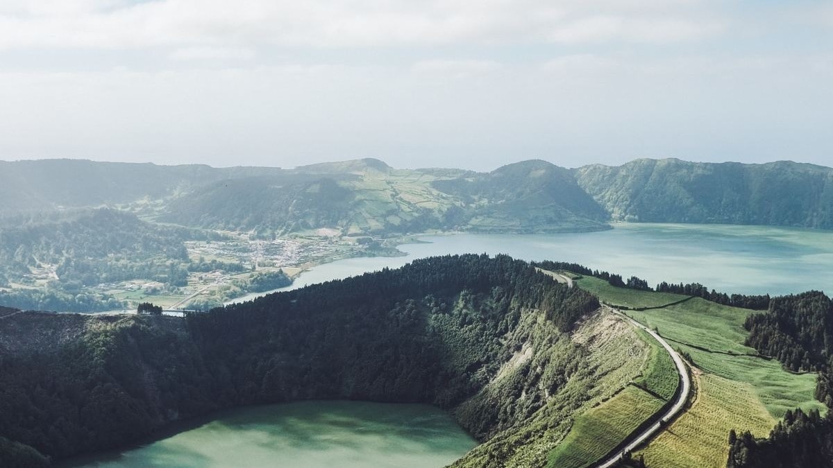 Birds-eye view of mountain with two bodies of water between.
