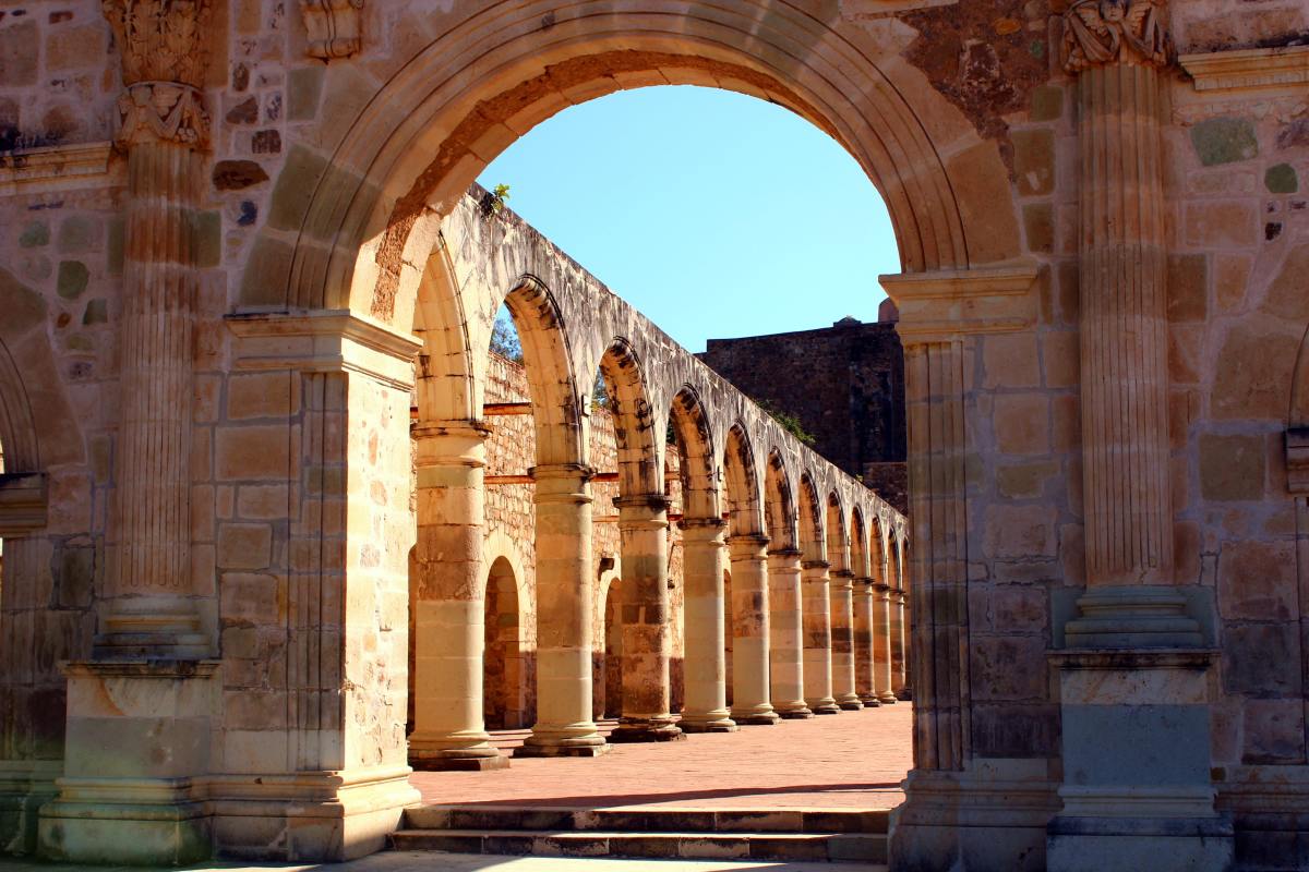 Arches of historic building in Oaxaca, Mexico on a sunny day.